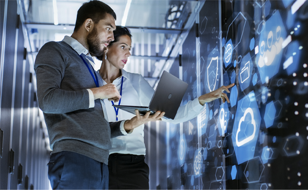 Two people looking at laptop