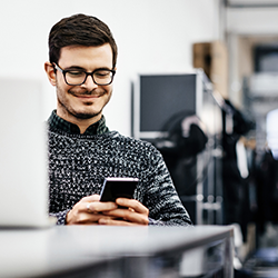 man working on mobile phone