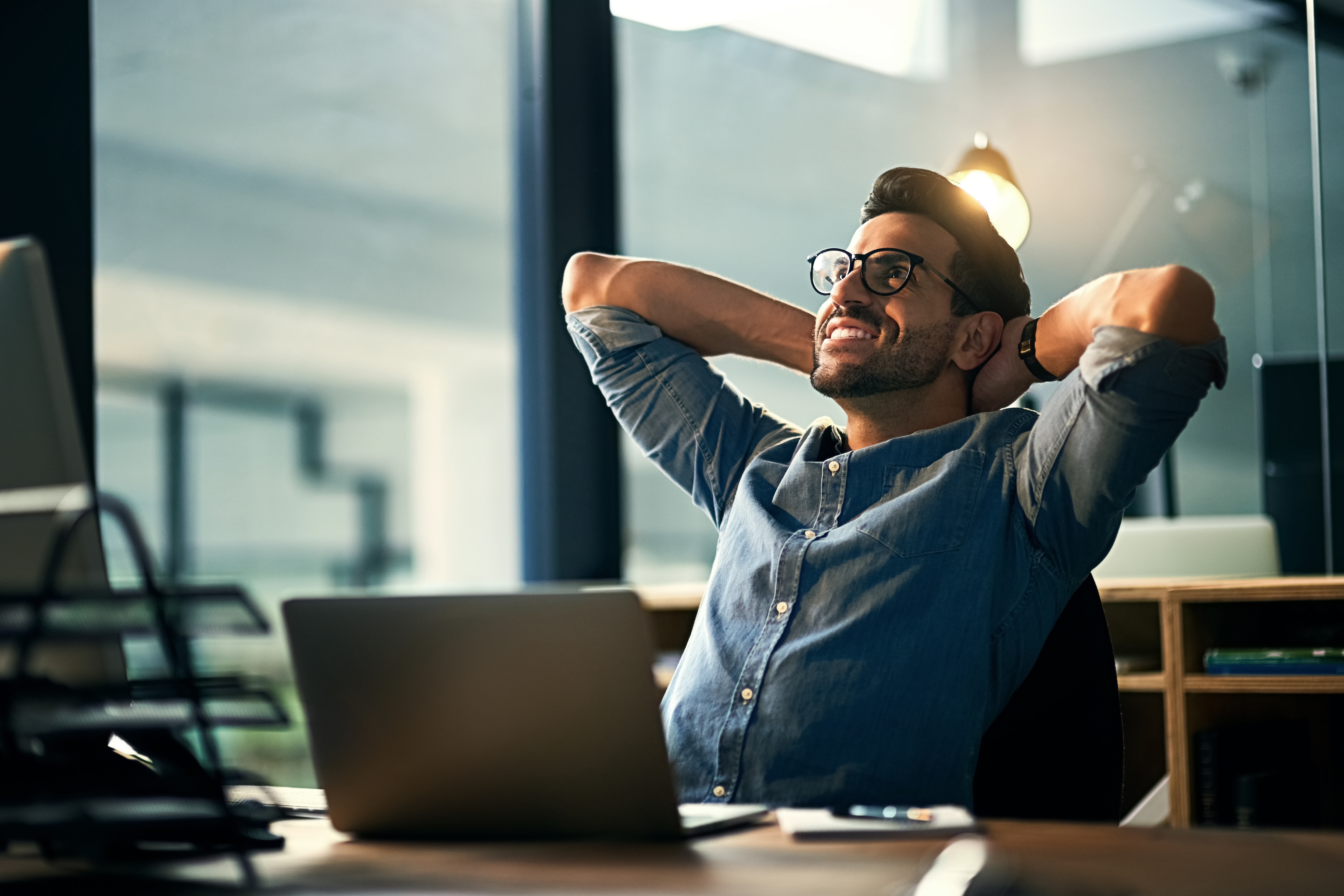 Man smiling at computer 