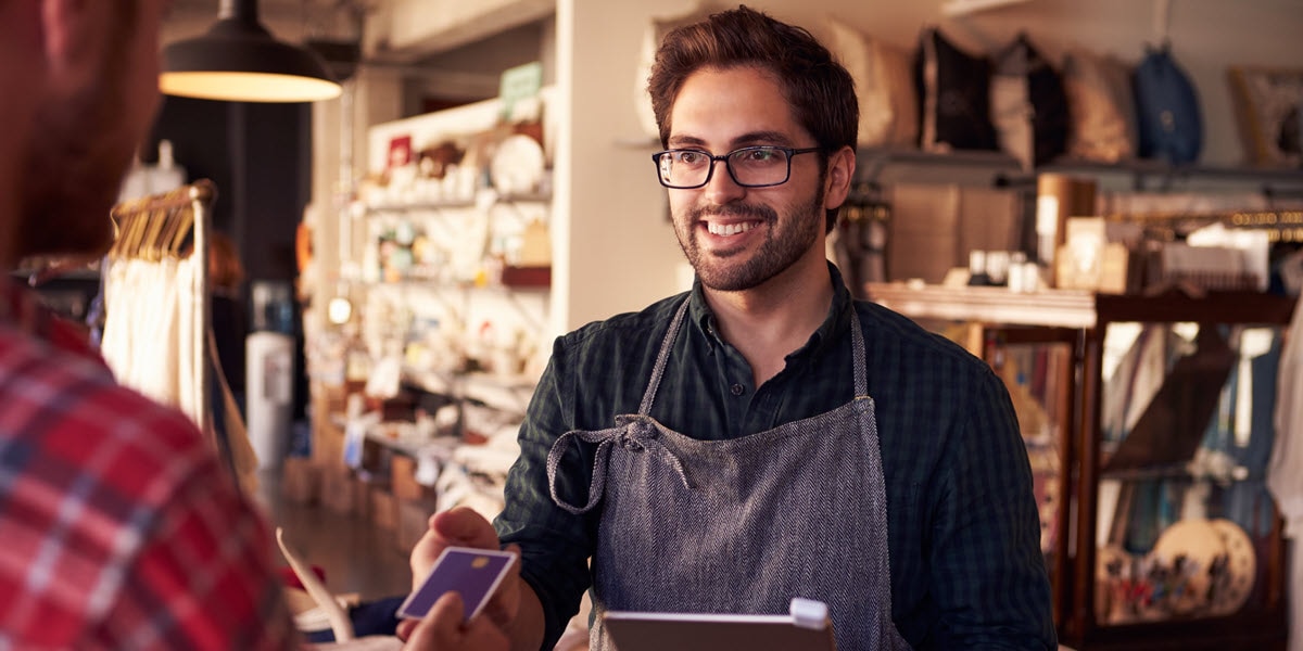 Merchant accepting credit card from customer