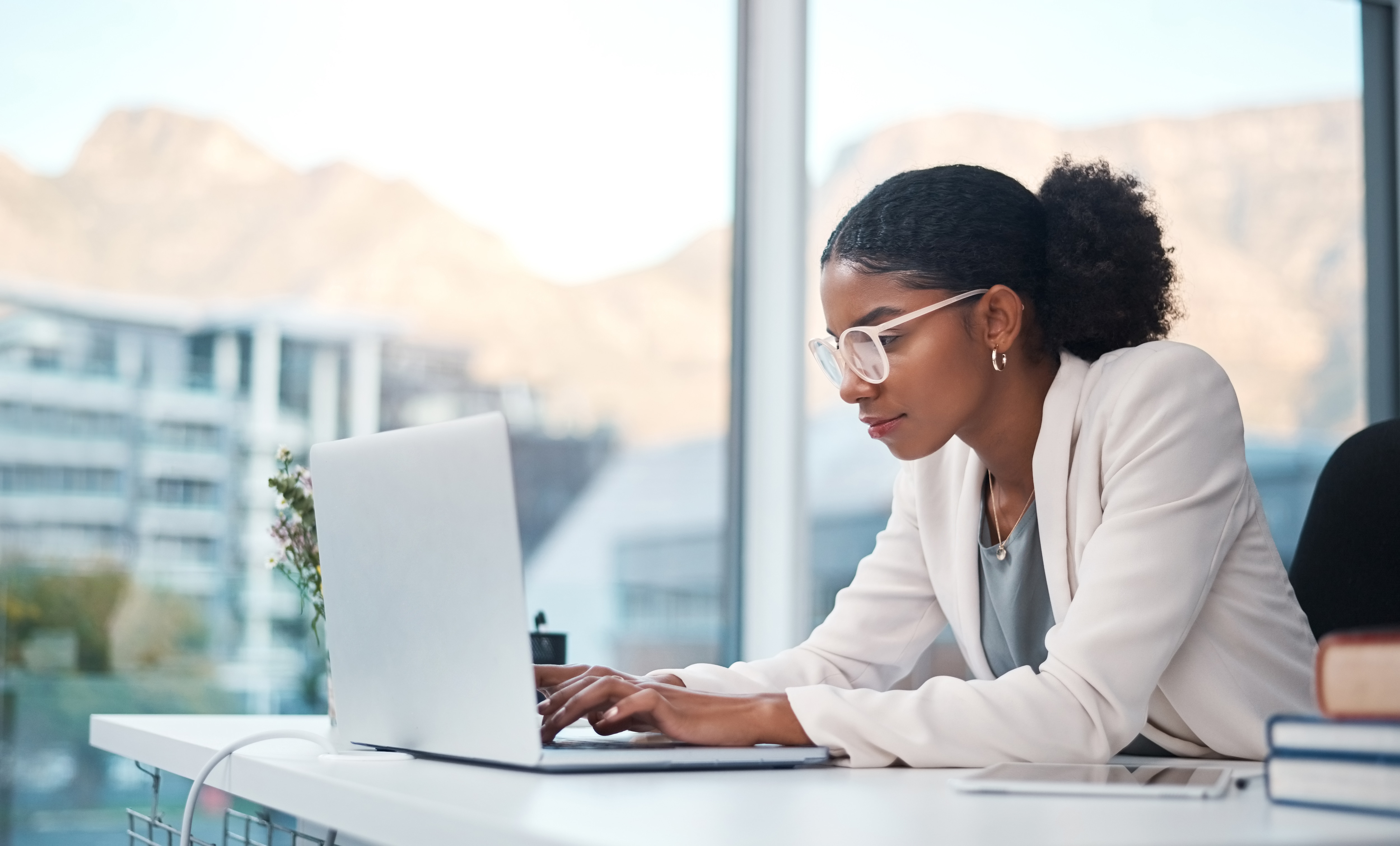 Woman at computer typing