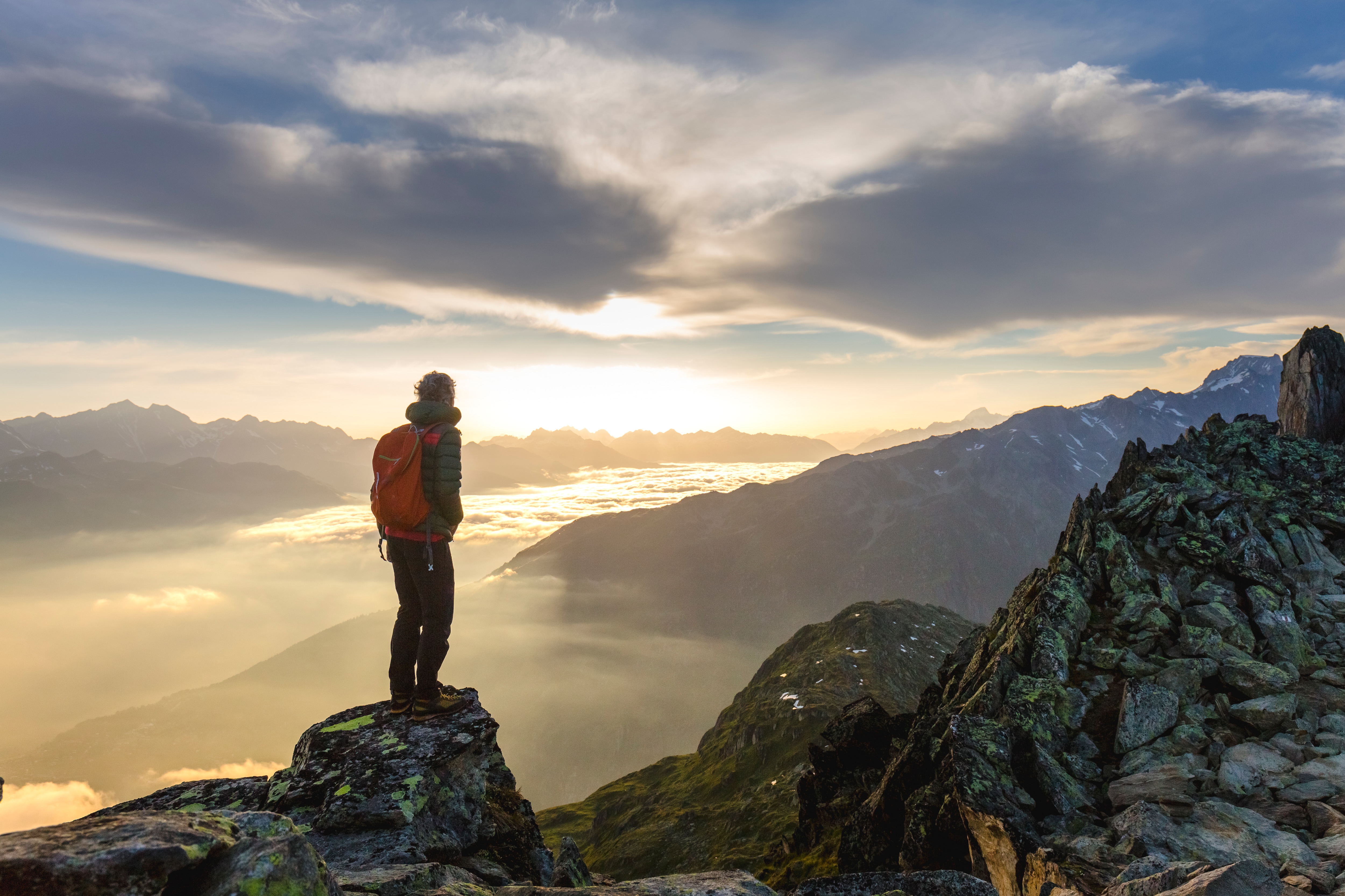 person standing on top of a mountain 