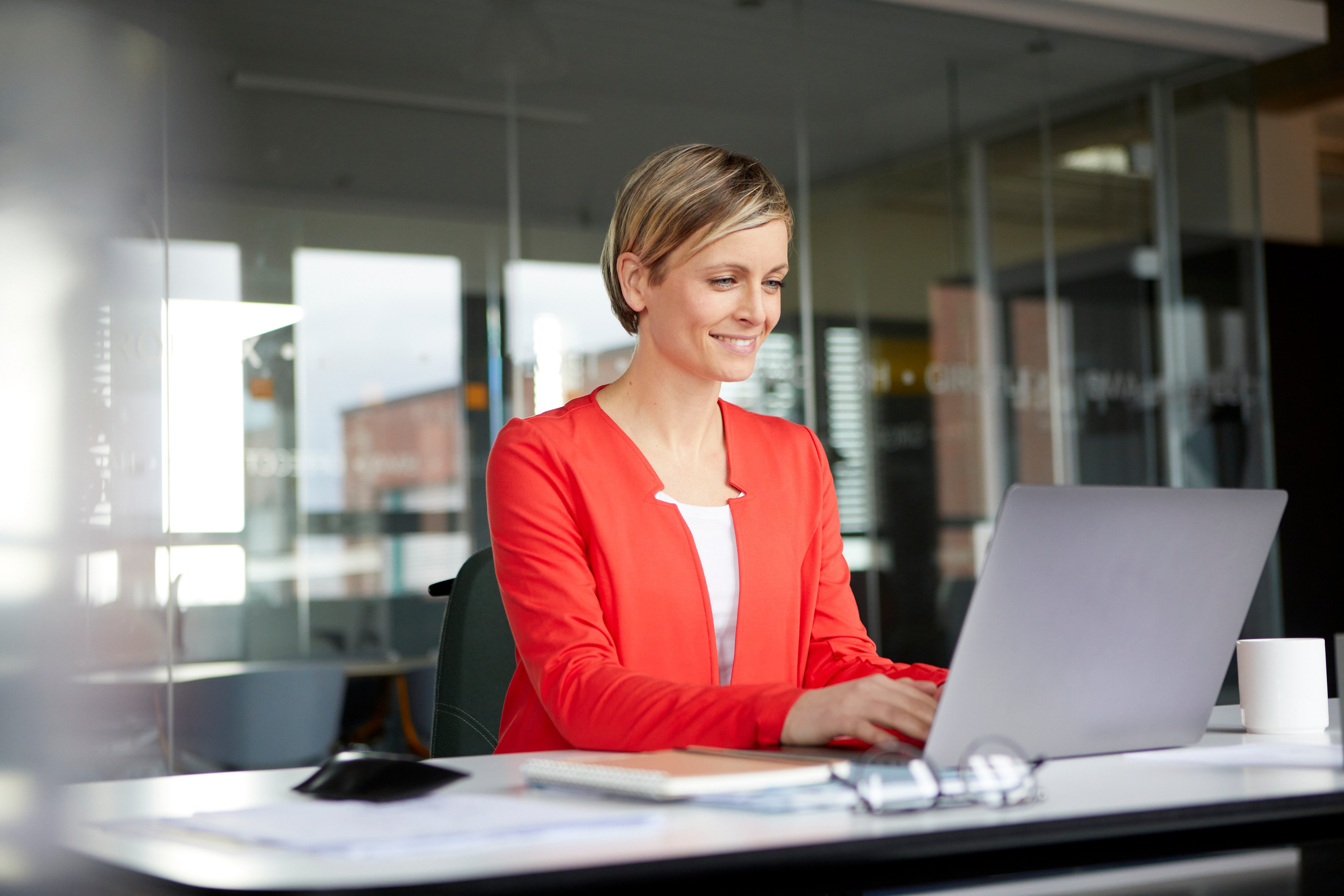 a woman looking at the laptop