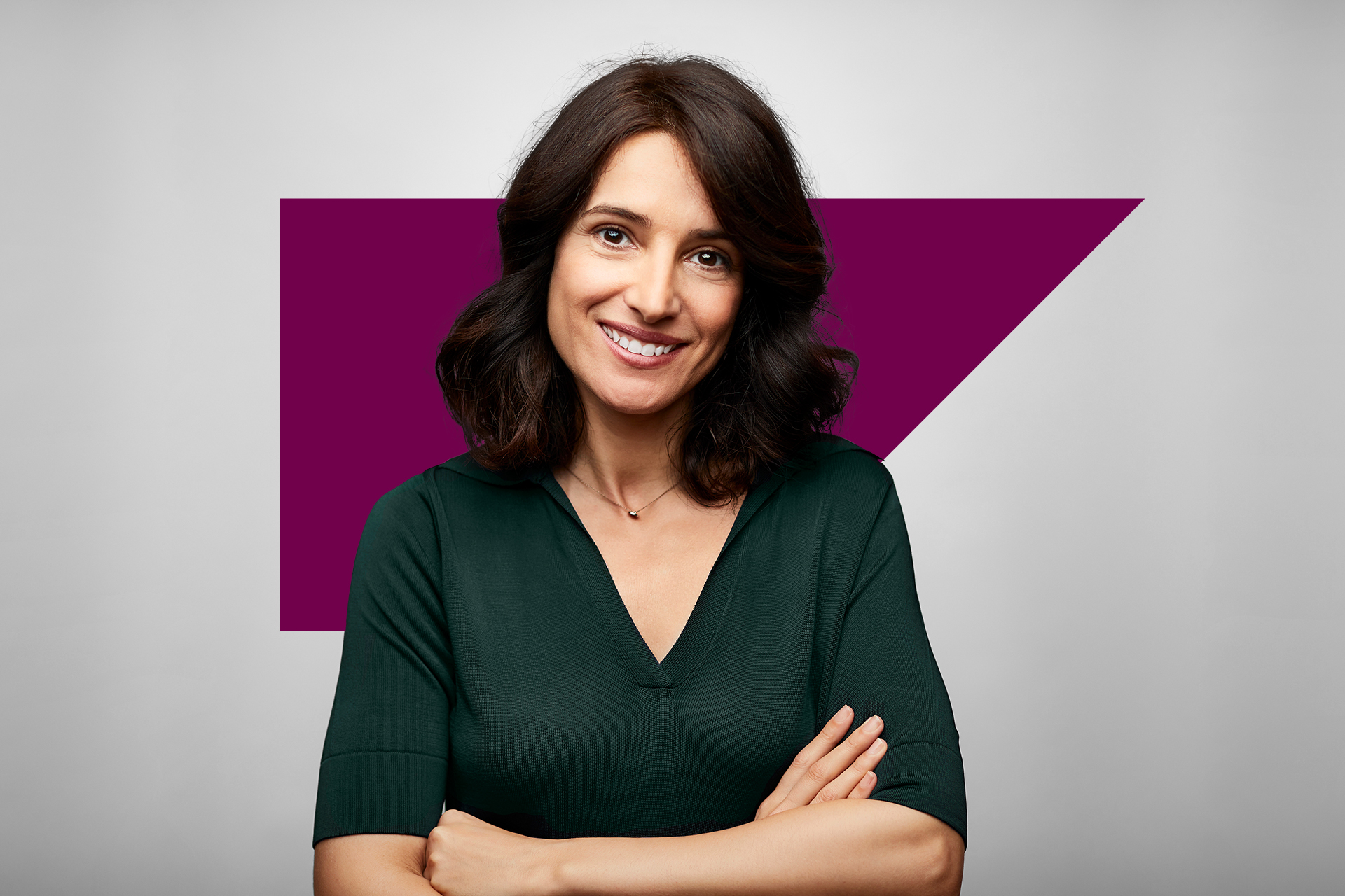 smiling woman with arms crossed