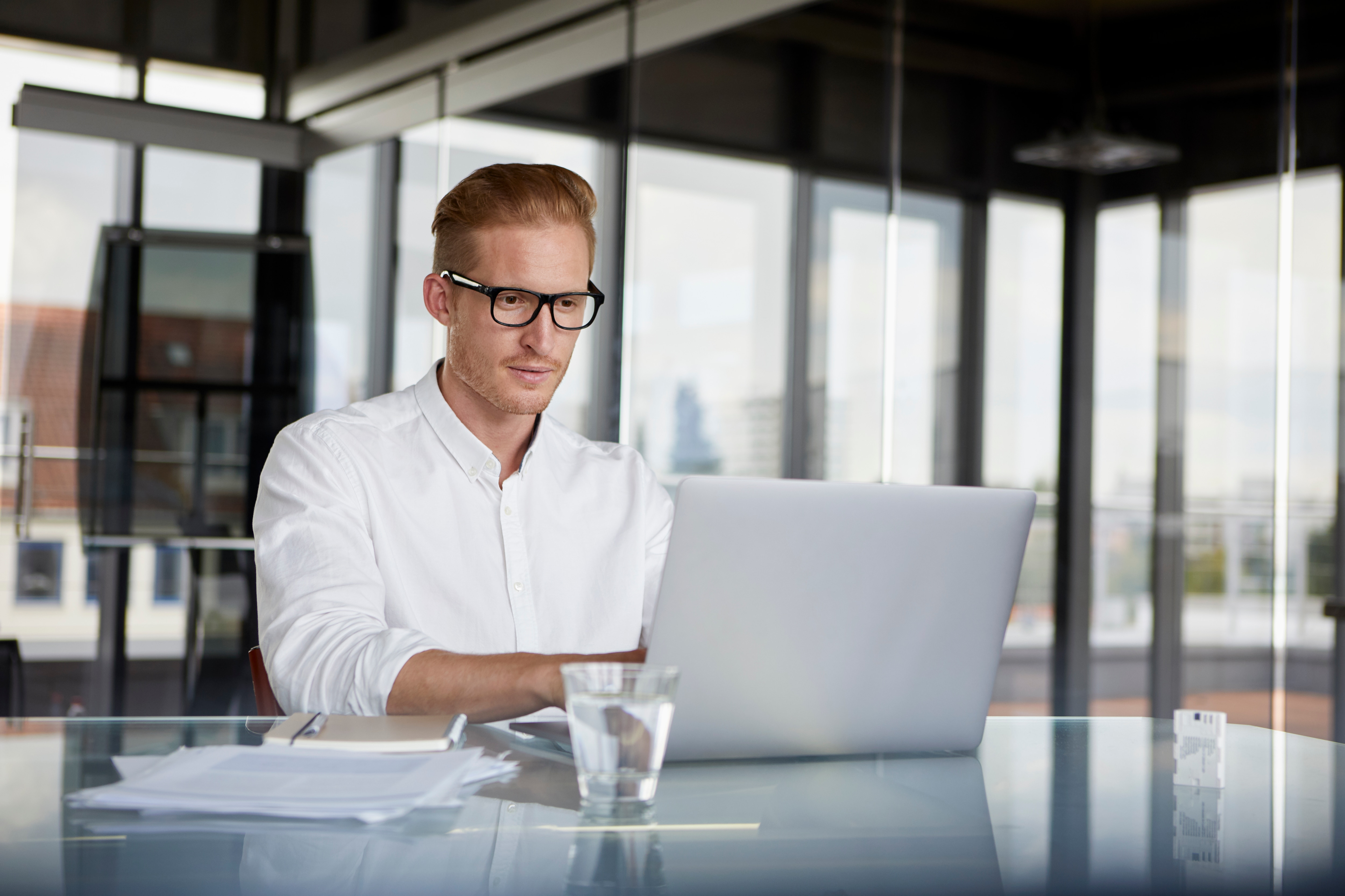 a businessman looking at his laptop