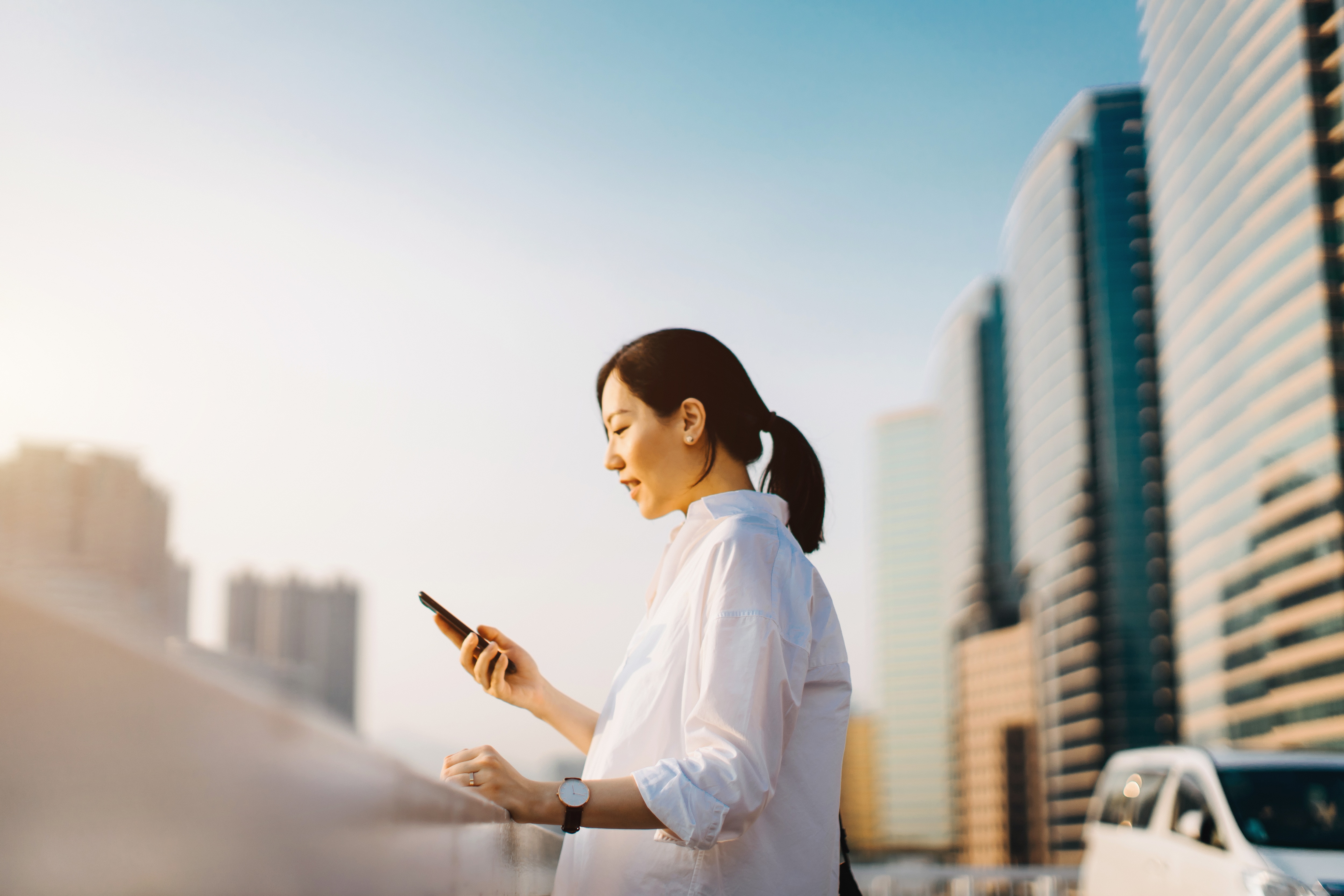 a woman is looking at her phone