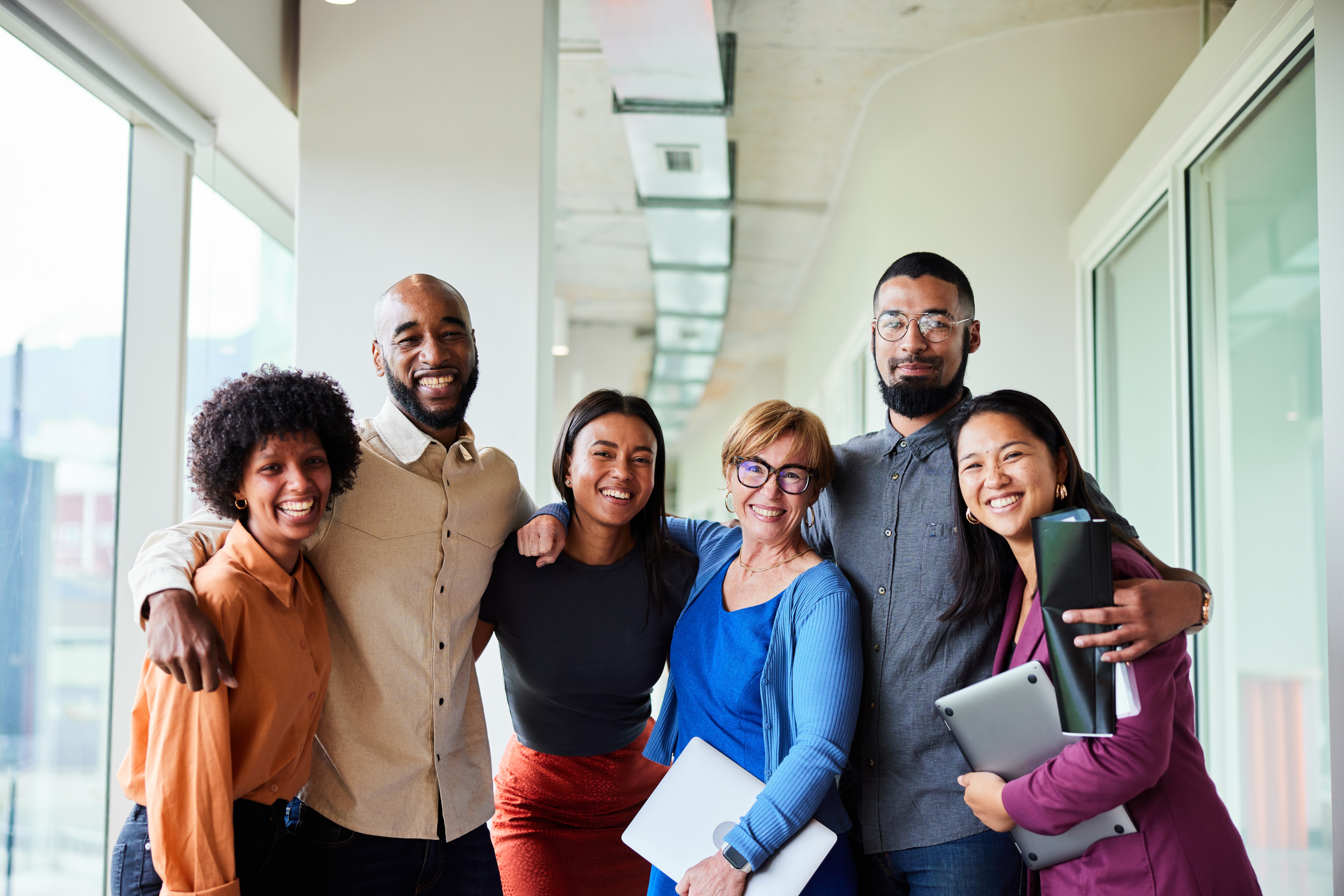 Woman with a book standing in front of a class