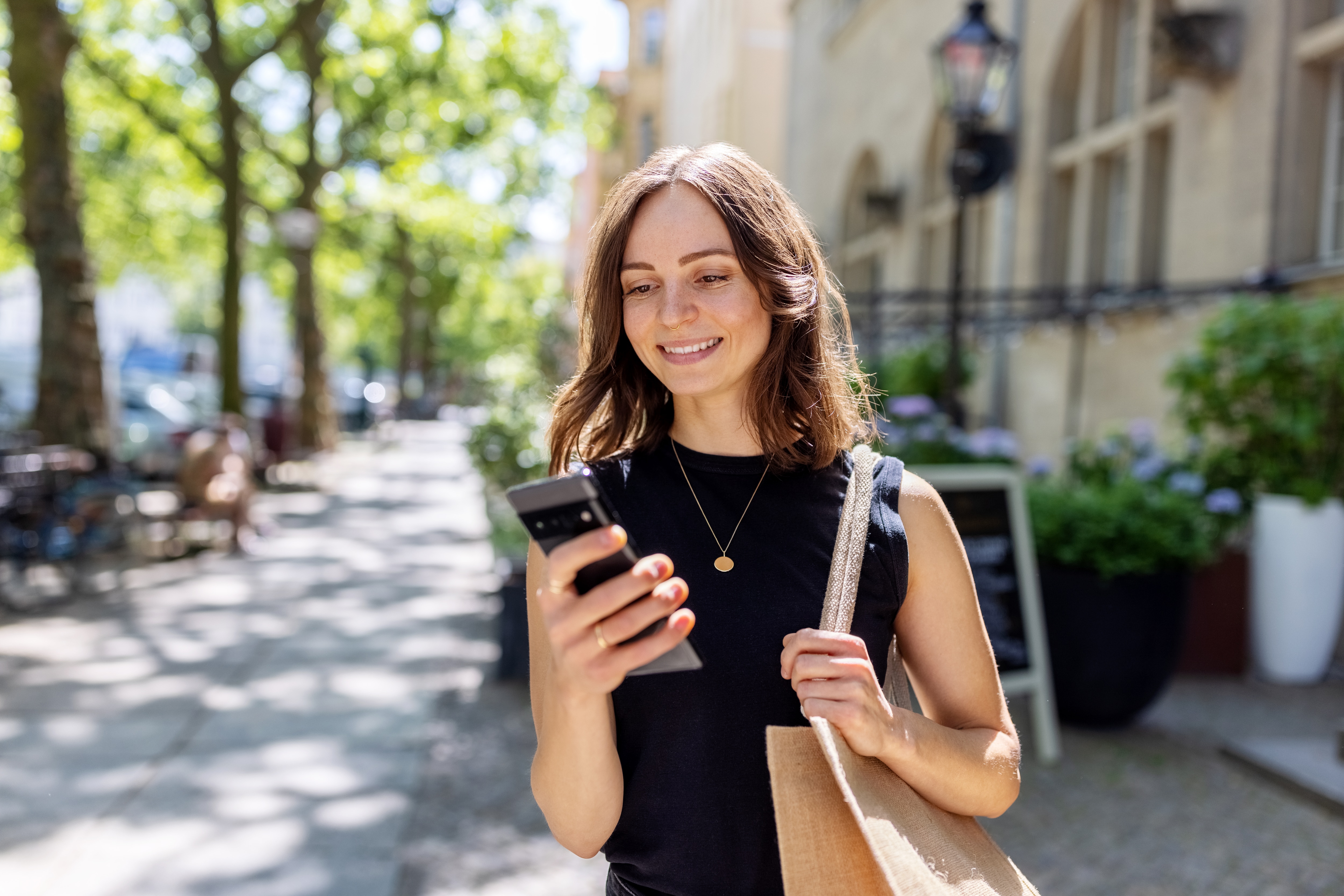 a woman looking at her mobile device