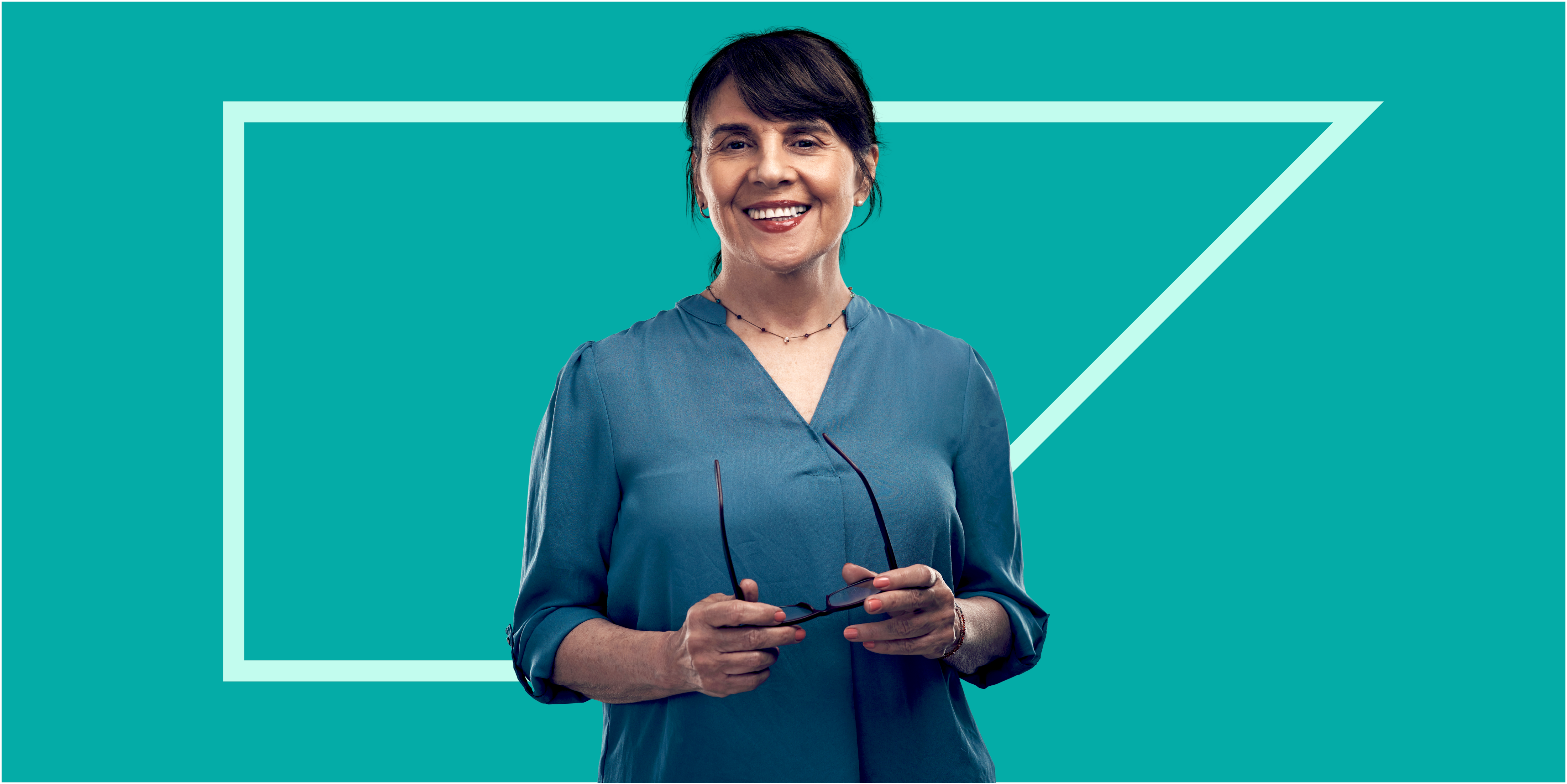 worker smiling in front of SAP Concur anvil