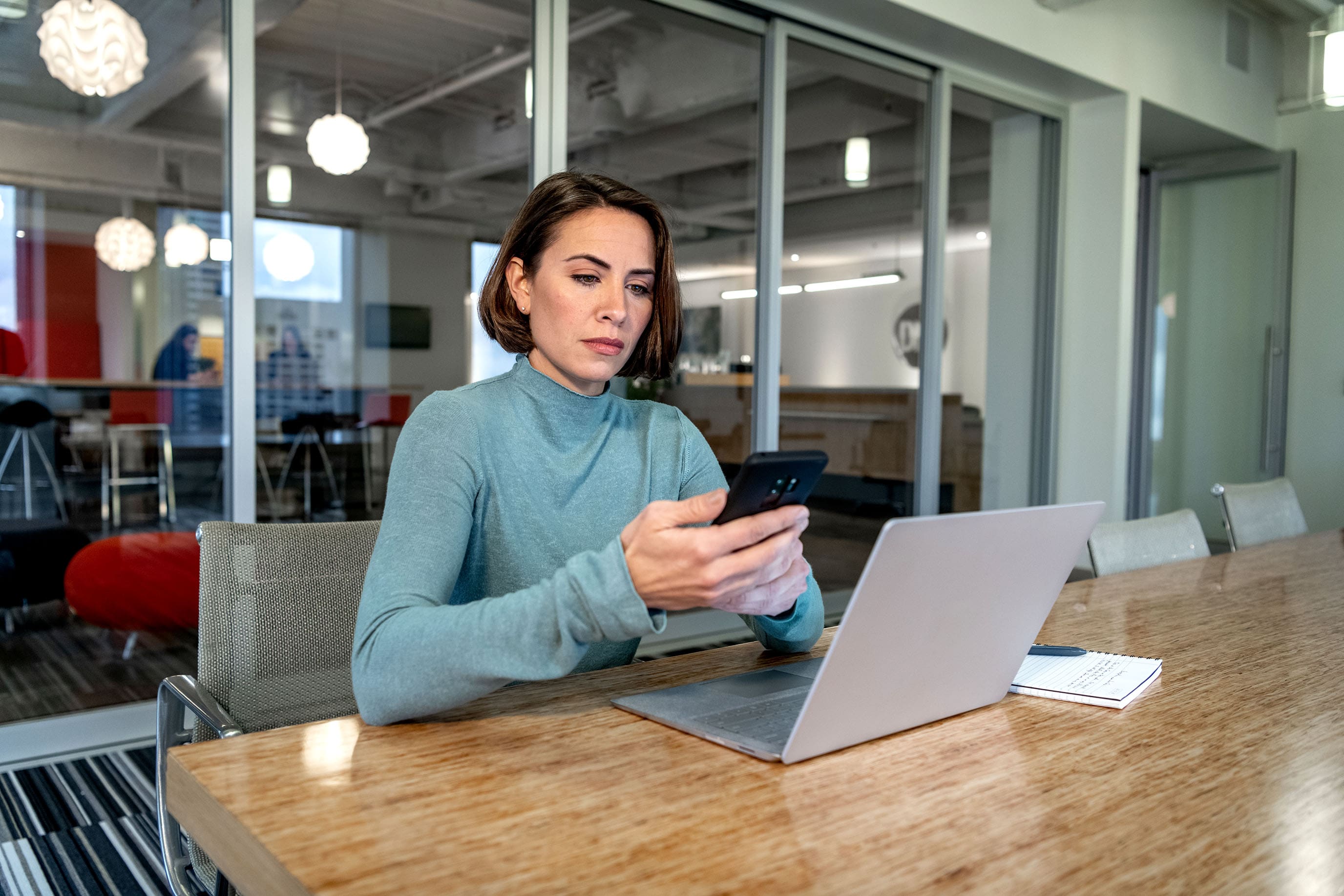 two people looking at screens