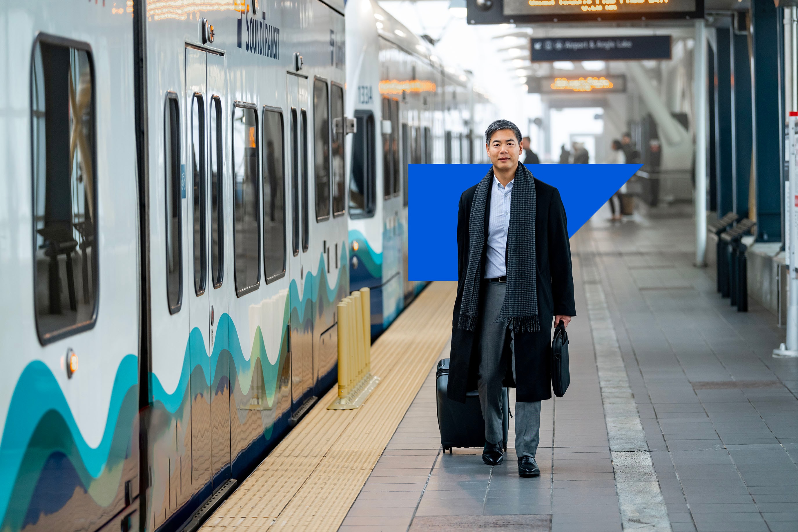 Man walking down the train line