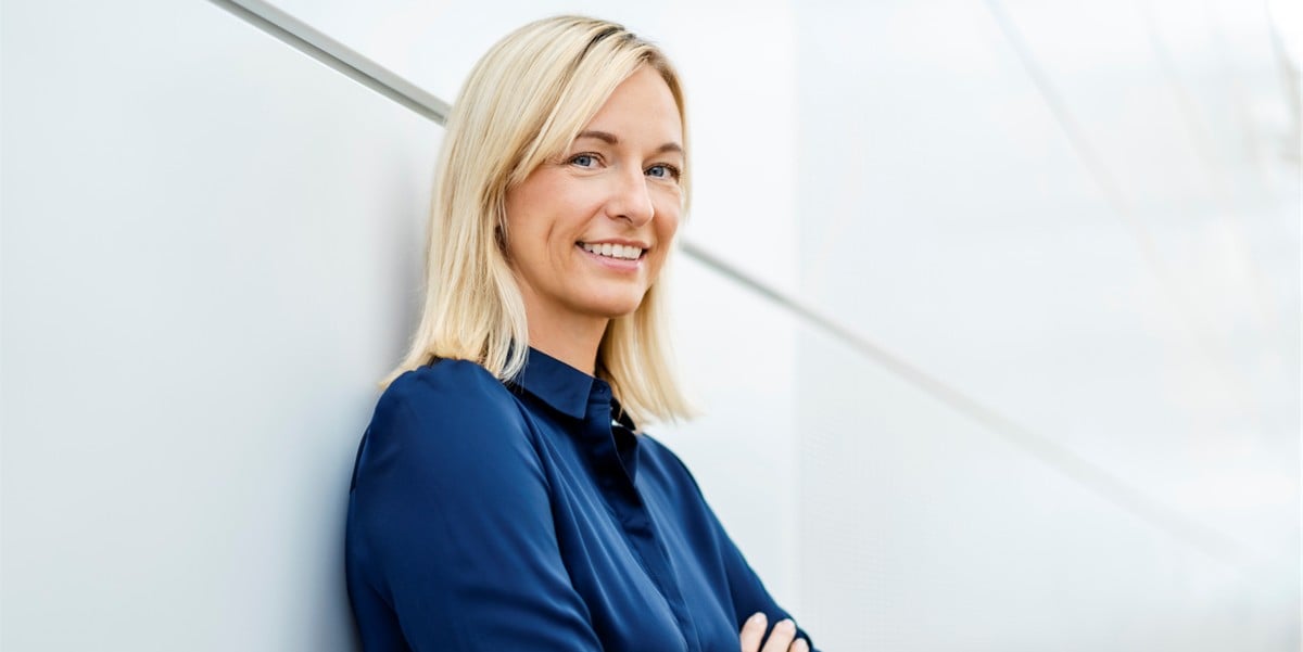 Blonde woman looking at camera