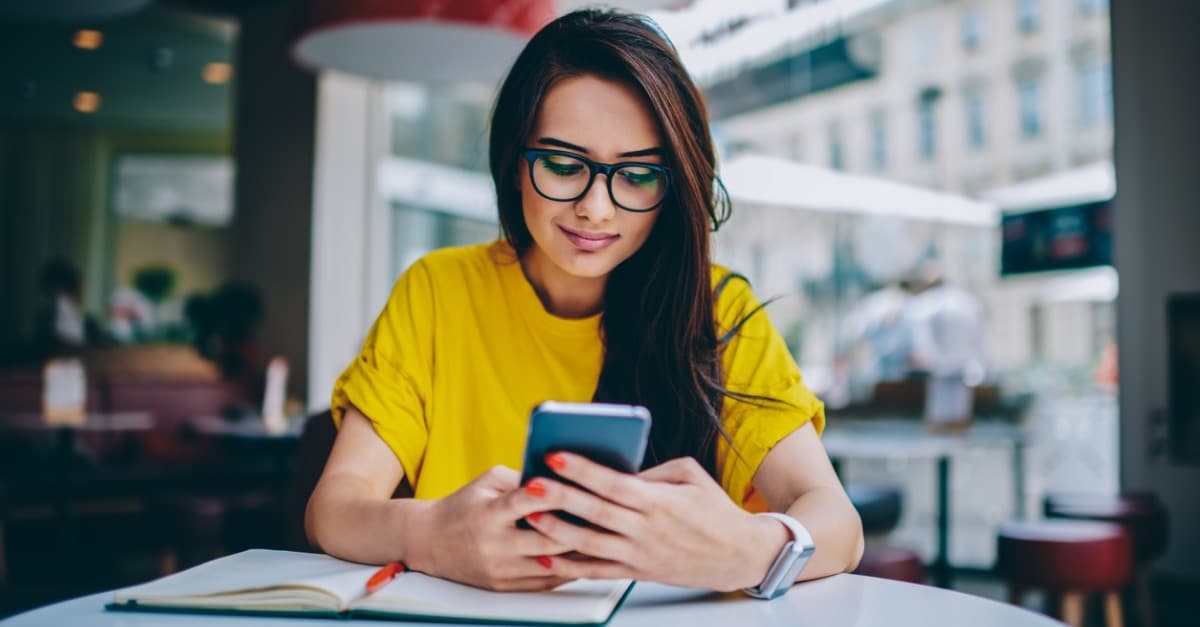 young woman blogger in spectacles