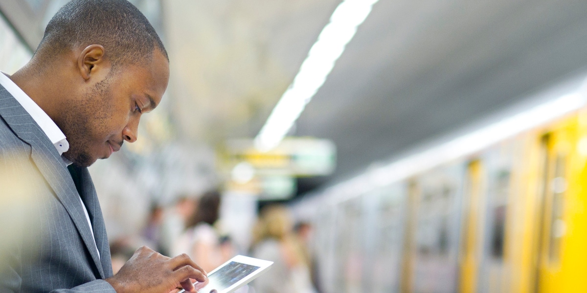 business traveler waiting at train station 