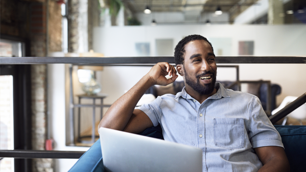 happy worker at laptop